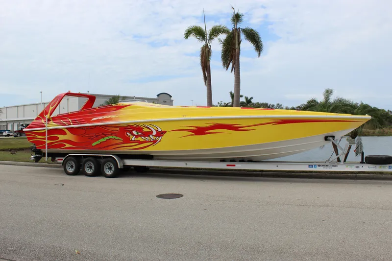 Slide: The Image of 2001 Sonic 42 SS speedboat with vibrant flame design on trailer. - 10