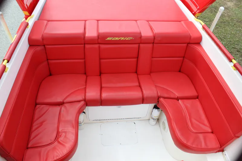 Slide: The Image of Red leather seating in a 2001 Sonic 42 SS boat interior. - 31