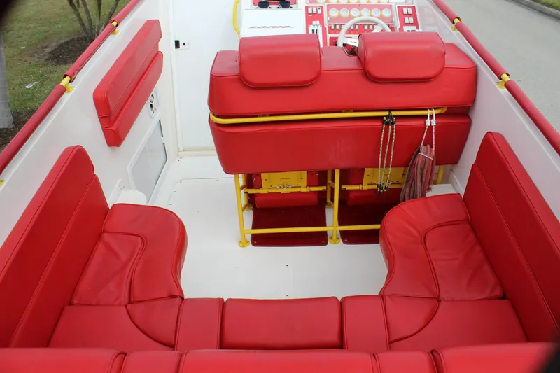 Slide: The Image of 2001 Sonic 42 SS boat interior with vibrant red seating and yellow accents. - 38