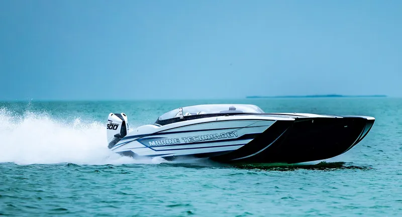 Slide: The Image of 2023 MTI 440X speedboat cruising on open water. - 1