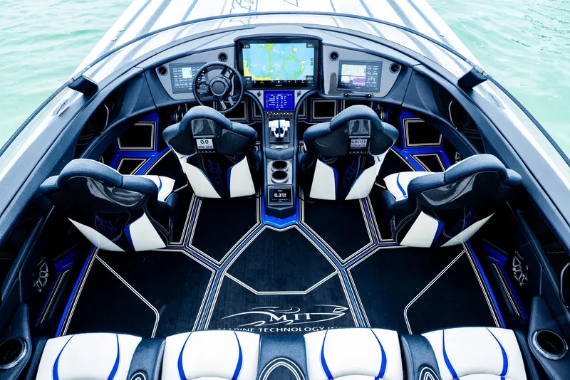 Slide: The Image of Interior of 2023 MTI 440X boat with advanced navigation system and luxury seating. - 9