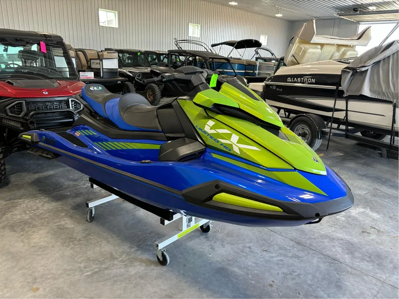 Slide: The Image of 2024 Yamaha Boats VX Limited HO in showroom, vibrant blue and green design. - 3