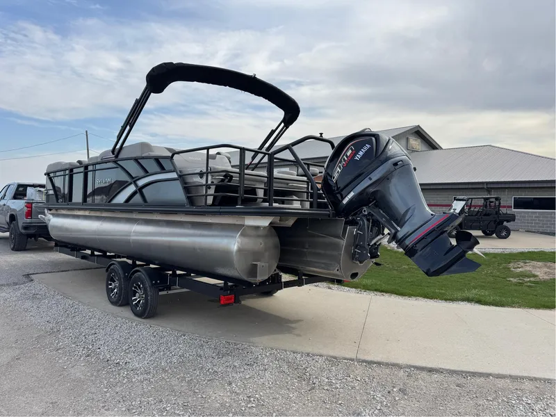 Slide: The Image of 2023 Sylvan L5 DLZ Bar pontoon boat with Yamaha outboard motor on trailer. - 16