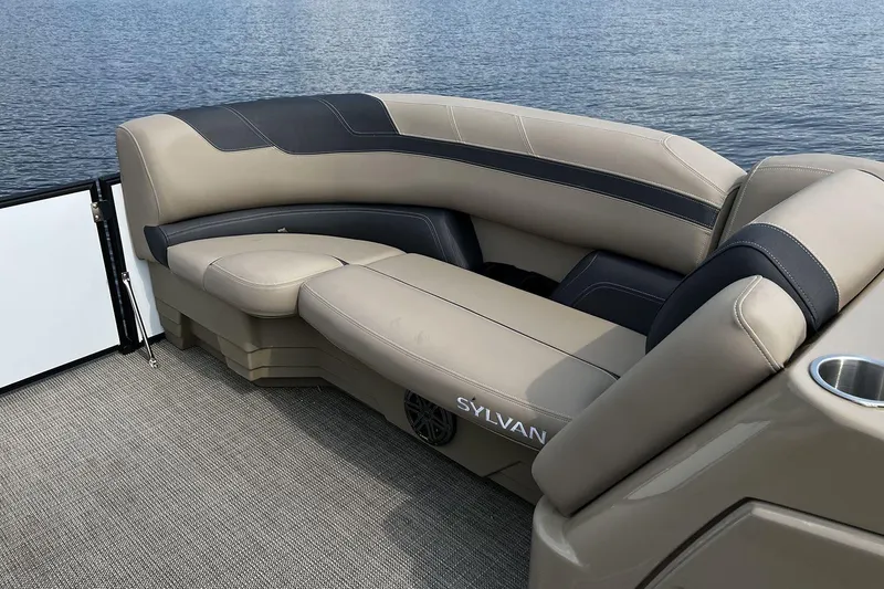 Slide: The Image of Luxurious seating on 2023 Sylvan L5 DLZ Bar pontoon boat by the water. - 34
