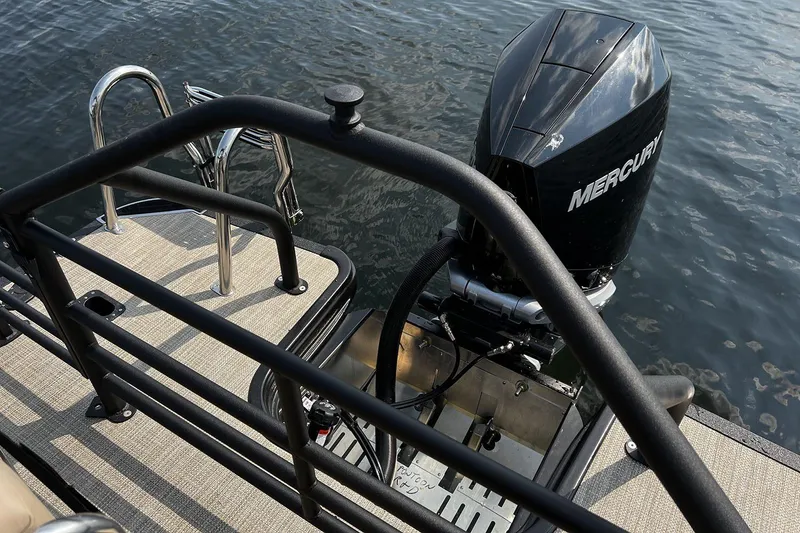 Slide: The Image of 2023 Sylvan L5 DLZ Bar pontoon boat with Mercury outboard motor on water. - 40