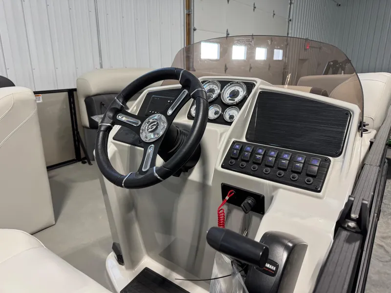 Slide: The Image of 2024 Sylvan MIRAGE 820 LZ boat dashboard with steering wheel and control panel. - 10