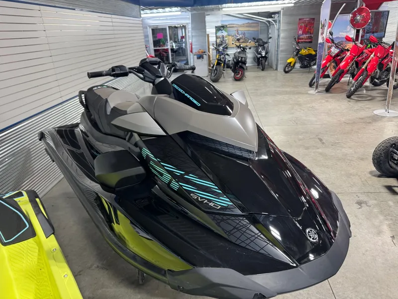 Slide: The Image of 2025 Yamaha GP SVHO with Audio jet ski in showroom, featuring sleek black design. - 3