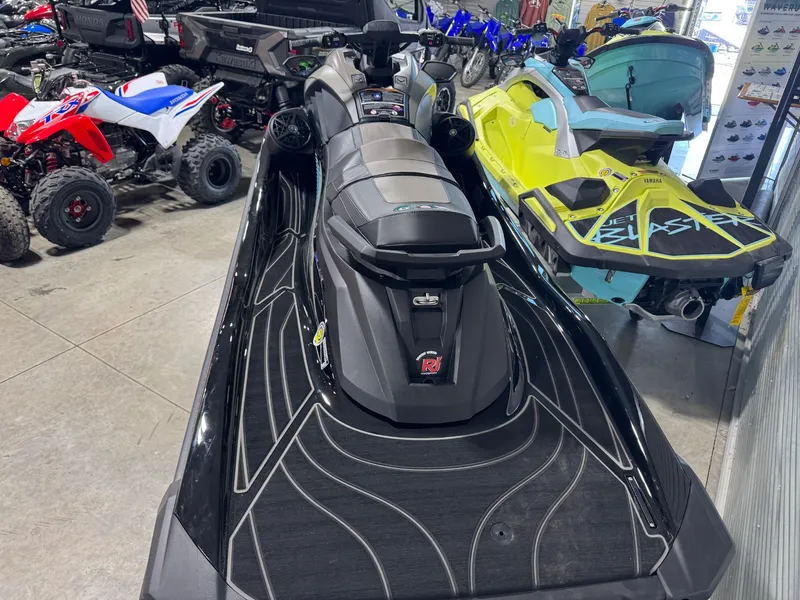 Slide: The Image of 2025 Yamaha GP SVHO with Audio jet ski in showroom, surrounded by other vehicles. - 4