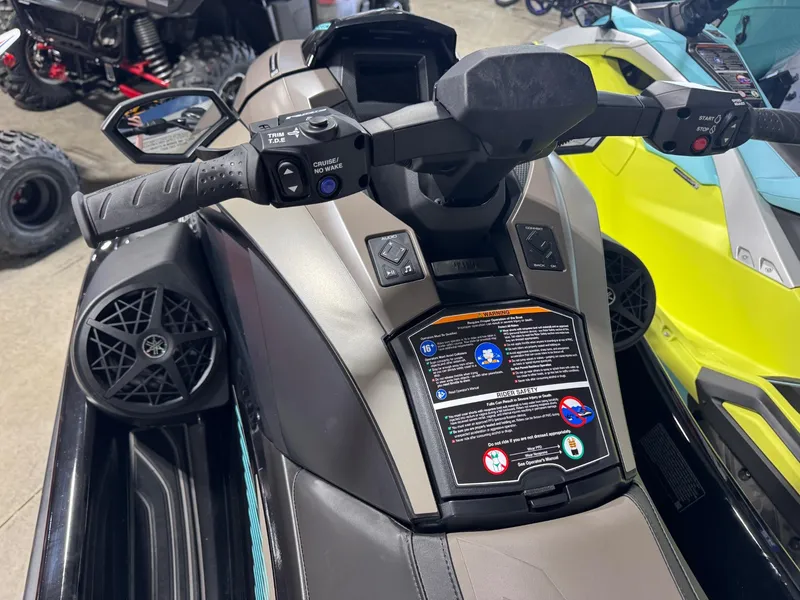 Slide: The Image of 2025 Yamaha GP SVHO with Audio, featuring handlebars and control panel, in a showroom setting. - 5