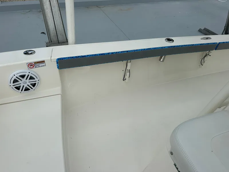 Slide: The Image of 2021 Pathfinder 2500 Hybrid boat interior with speaker and seating area. - 16