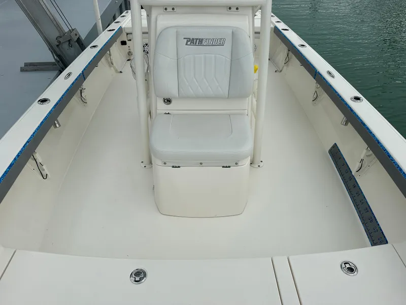 Slide: The Image of 2021 Pathfinder 2500 Hybrid boat interior with seating and storage compartments. - 18