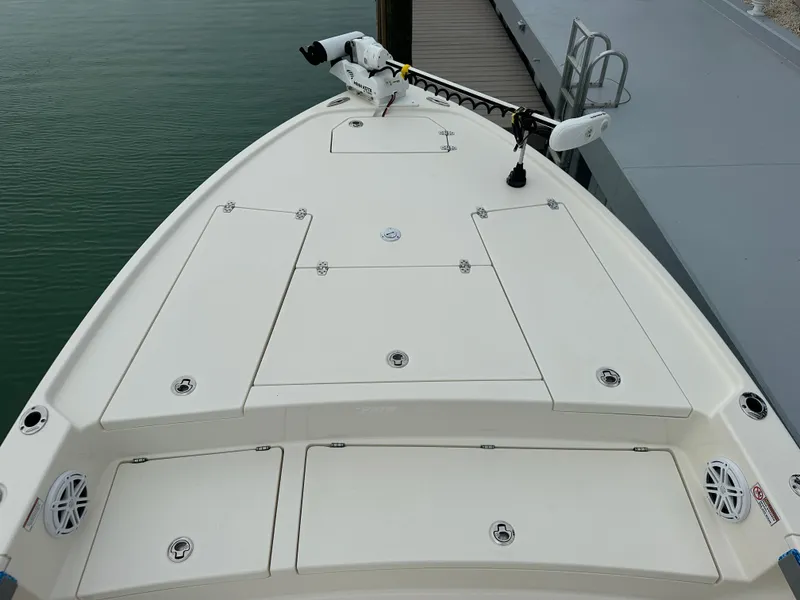 Slide: The Image of 2021 Pathfinder 2500 Hybrid boat deck with storage compartments and trolling motor. - 19