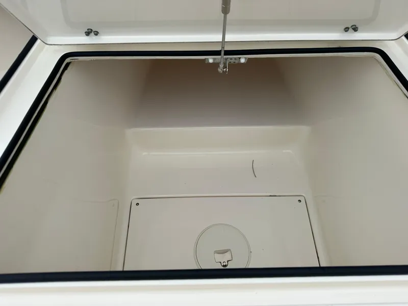 Slide: The Image of Open storage compartment in 2021 Pathfinder 2500 Hybrid boat. - 24