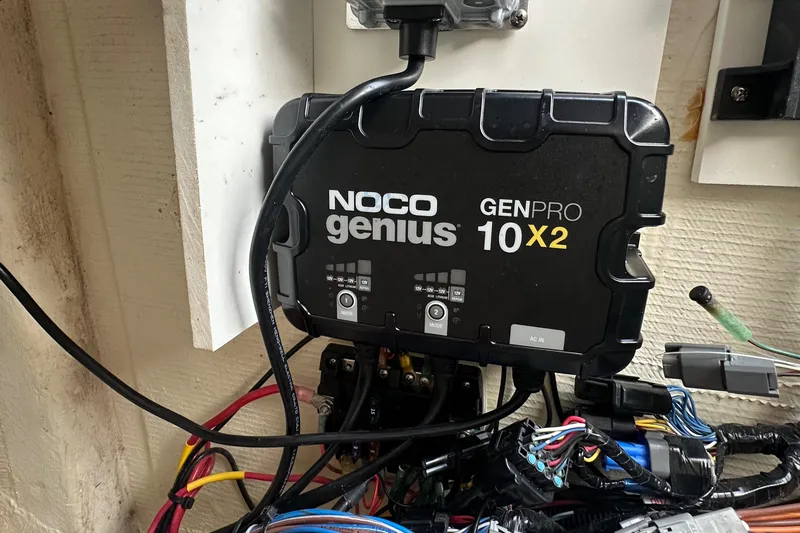 Slide: The Image of NOCO Genius GENPRO 10X2 charger installed on a 2021 Pathfinder 2500 Hybrid. - 27