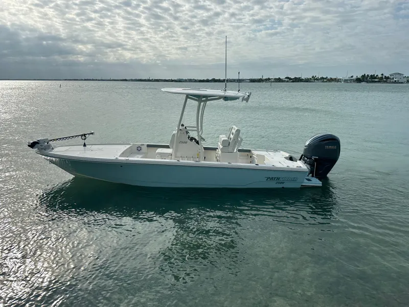 Slide: The Image of 2021 Pathfinder 2500 Hybrid boat on calm water under cloudy sky. - 3