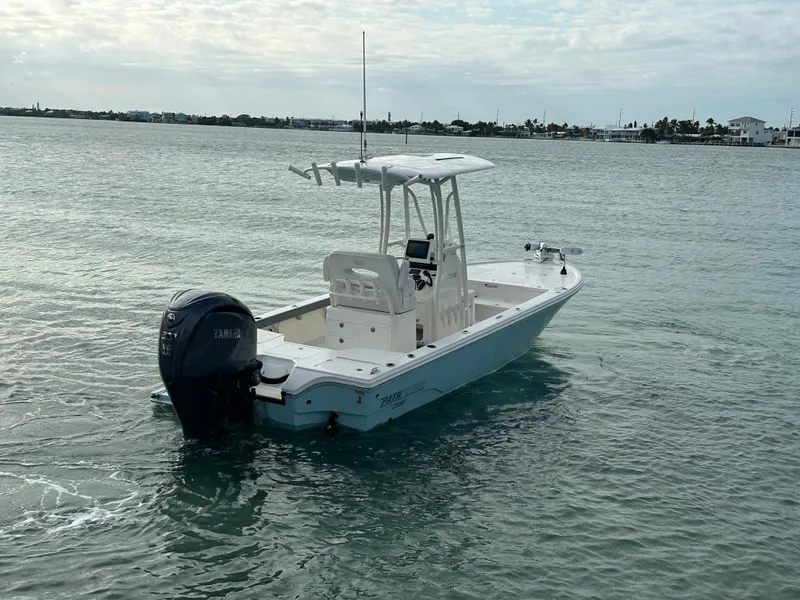 Slide: The Image of 2021 Pathfinder 2500 Hybrid boat on calm water with Yamaha outboard motor. - 4