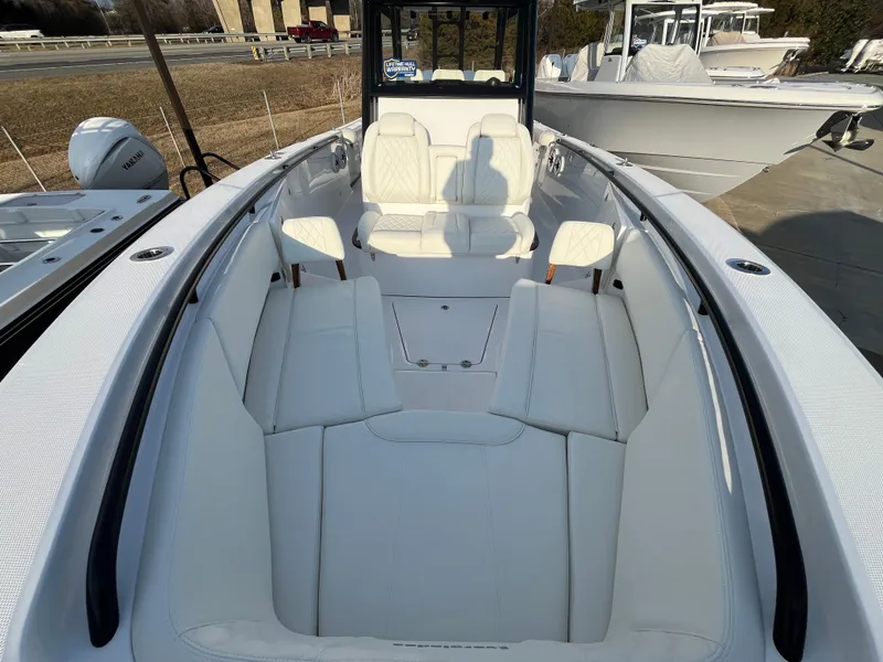 Slide: The Image of 2025 Everglades 335 Center Console boat with spacious seating and modern design. - 11