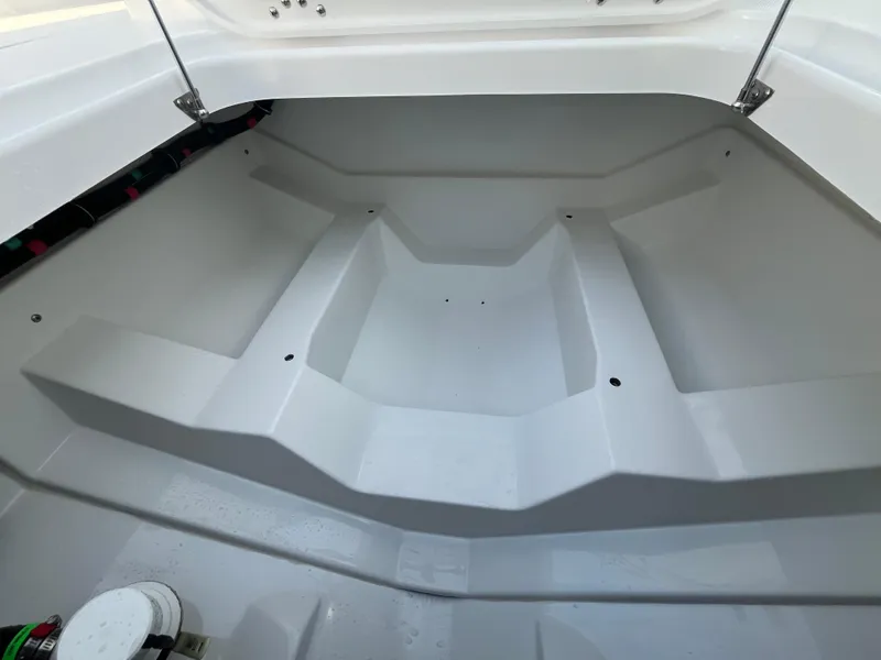 Slide: The Image of 2025 Everglades 335 Center Console interior storage compartment, showcasing spacious design. - 14