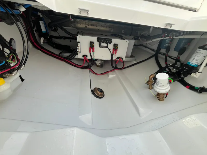 Slide: The Image of 2025 Everglades 335 Center Console boat wiring and components in the engine compartment. - 15