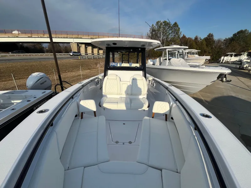 Slide: The Image of 2025 Everglades 335 Center Console boat with spacious seating and sleek design. - 18