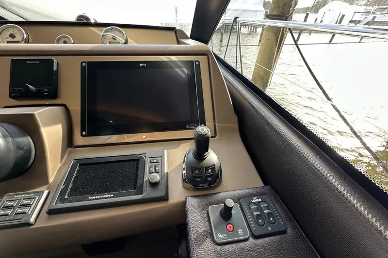 Slide: The Image of Control panel of a 2017 Prestige 500 yacht with navigation equipment. - 12
