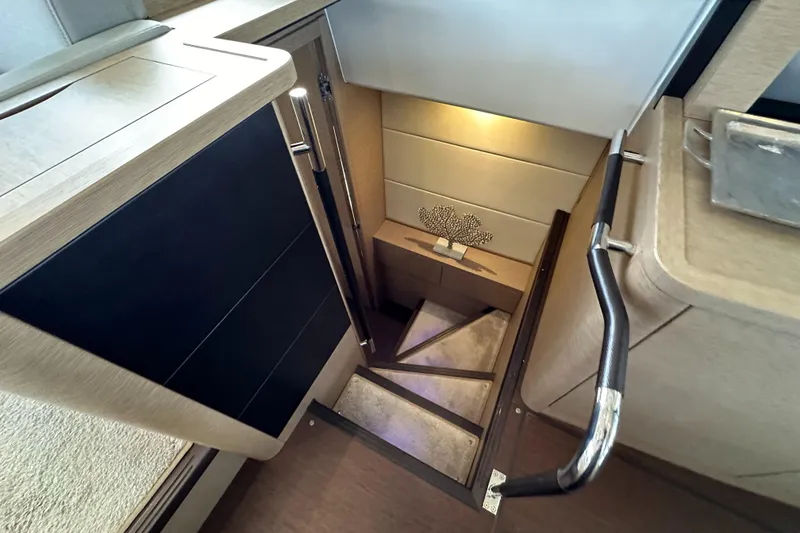 Slide: The Image of Staircase in 2017 Prestige 500 yacht interior, featuring modern design and elegant lighting. - 16