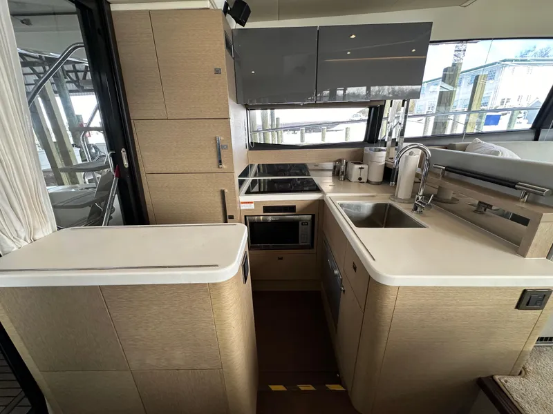 Slide: The Image of Modern kitchen interior of 2017 Prestige 500 yacht with sleek cabinetry and appliances. - 2