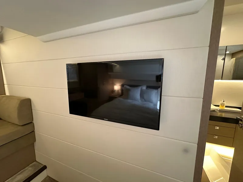 Slide: The Image of Flat-screen TV in 2017 Prestige 500 yacht interior, featuring modern design and cozy ambiance. - 20