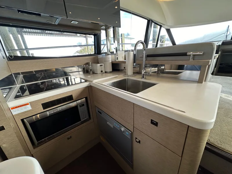 Slide: The Image of Modern kitchen in 2017 Prestige 500 yacht with sleek appliances and spacious countertop. - 3