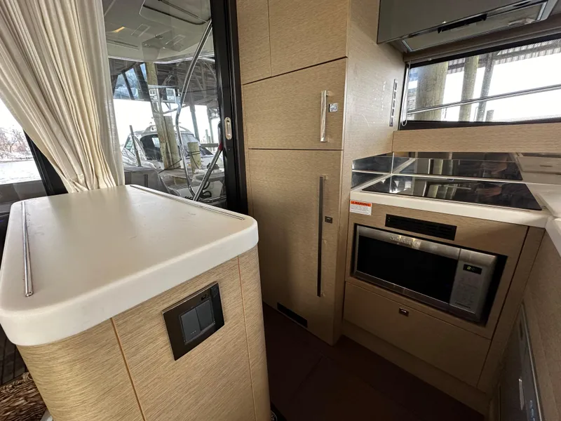 Slide: The Image of Modern kitchen interior of 2017 Prestige 500 yacht with sleek appliances and cabinetry. - 4