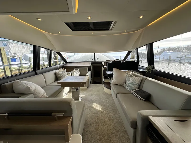 Slide: The Image of Luxurious interior of 2017 Prestige 500 yacht with elegant seating and panoramic windows. - 5