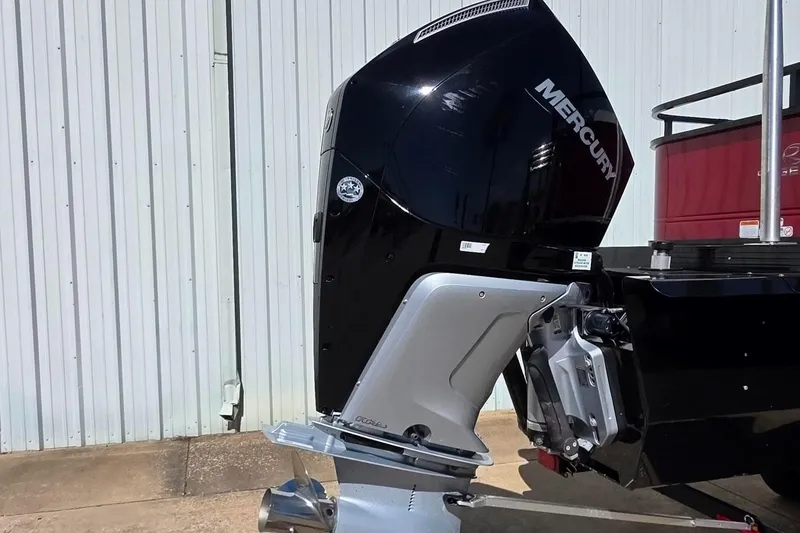 Slide: The Image of 2023 Regency 250 DL3 boat with Mercury outboard motor, side view. - 6