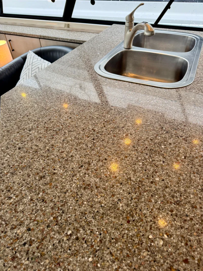 Slide: The Image of Granite countertop with dual sink in 1996 Bayliner 4788 Pilothouse yacht. - 12