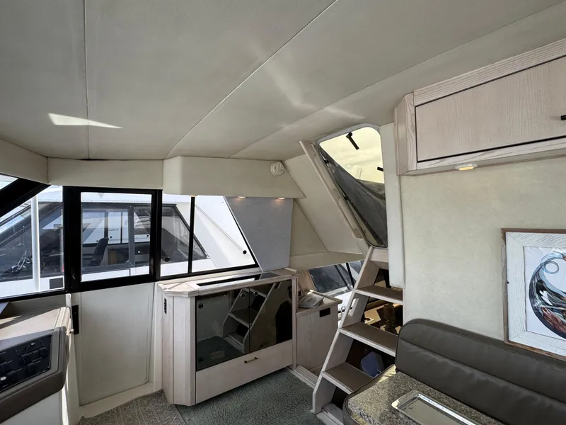 Slide: The Image of Interior of 1996 Bayliner 4788 Pilothouse with modern furnishings and ample natural light. - 30