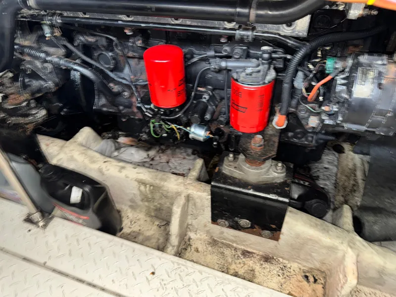 Slide: The Image of Engine compartment of a 1996 Bayliner 4788 Pilothouse with visible red filters. - 32