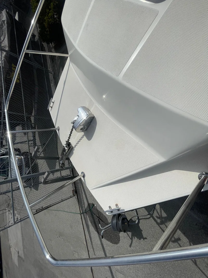 Slide: The Image of 2009 C-Dory TOMCAT 255 boat deck with anchor and railing. - 15