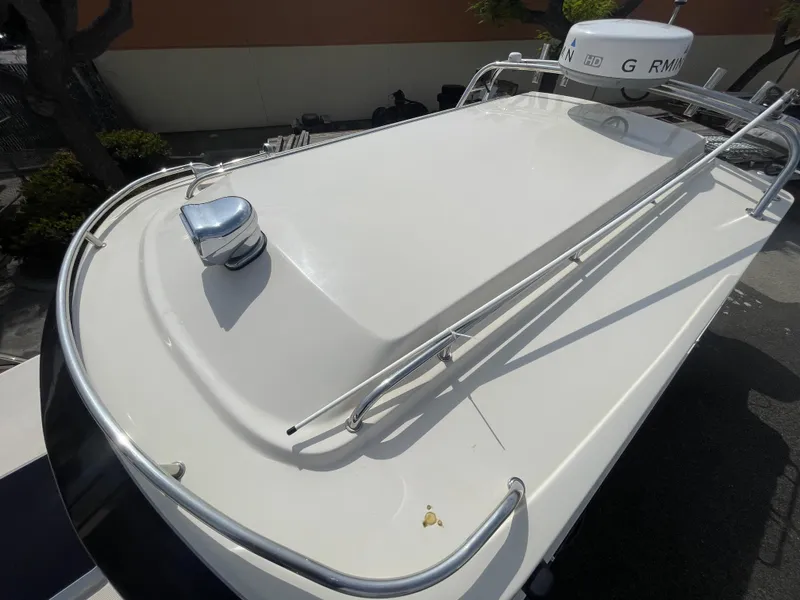 Slide: The Image of 2009 C-Dory TOMCAT 255 boat roof with railing and radar equipment. - 16