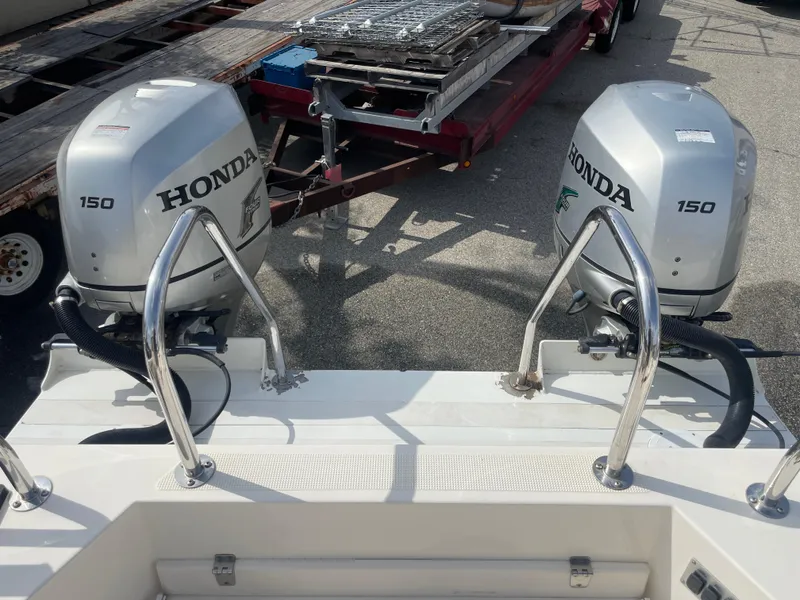 Slide: The Image of 2009 C-Dory TOMCAT 255 with dual Honda 150 outboard engines. - 47