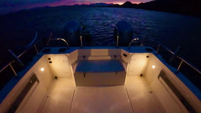 Slide: The Image of 2009 C-Dory TOMCAT 255 boat interior illuminated at sunset on the water. - 69