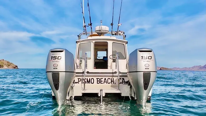 Slide: The Image of 2009 C-Dory TOMCAT 255 boat with dual Honda 150 engines on open water. - 71