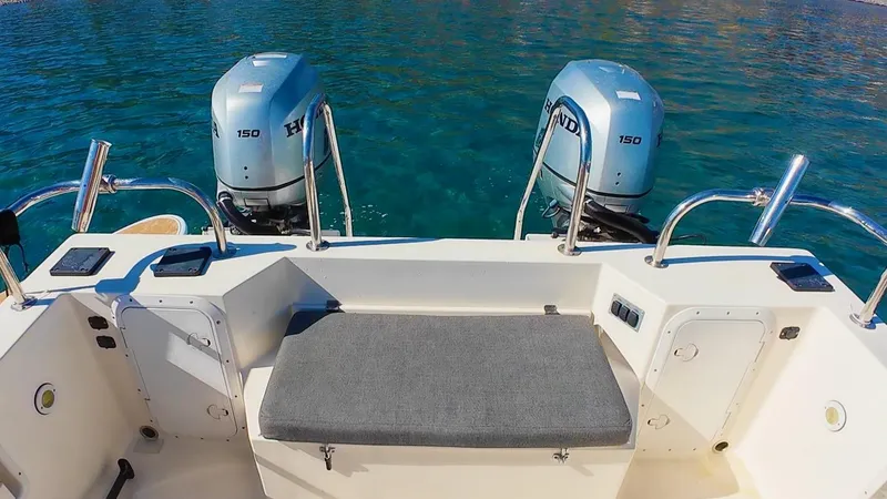 Slide: The Image of 2009 C-Dory TOMCAT 255 boat with dual outboard motors on clear water. - 72