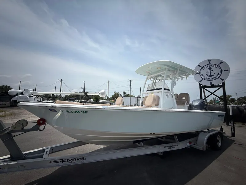 Slide: The Image of 2020 Sportsman Masters 247 Bay Boat on trailer, displayed outdoors under a clear sky. - 12