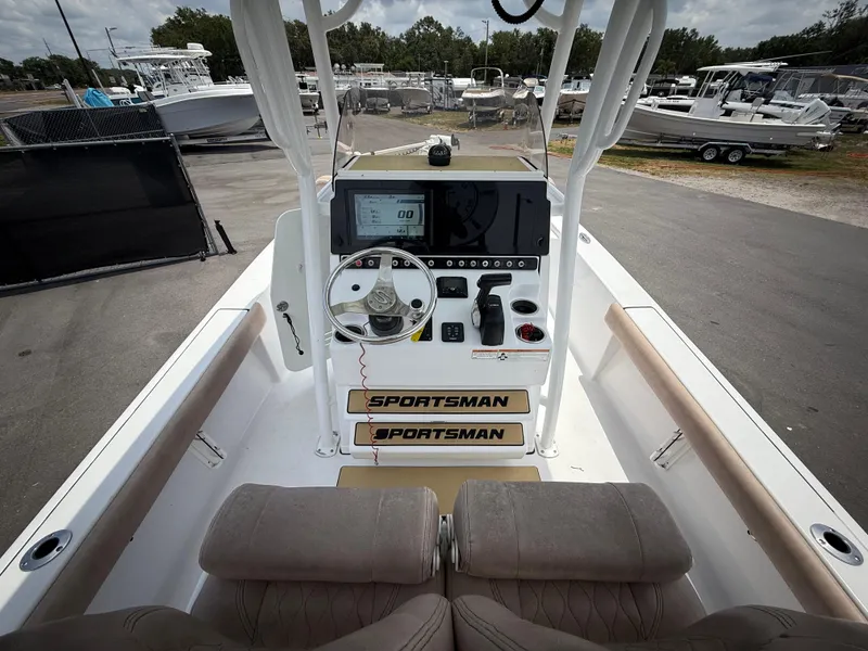 Slide: The Image of 2020 Sportsman Masters 247 Bay Boat cockpit with steering wheel and control panel. - 19