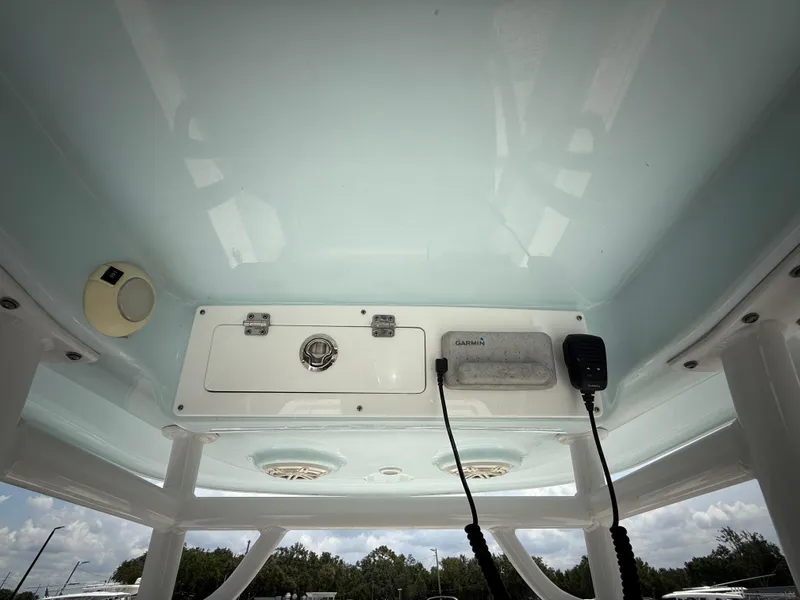 Slide: The Image of 2020 Sportsman Masters 247 Bay Boat console with electronics and storage compartments. - 26
