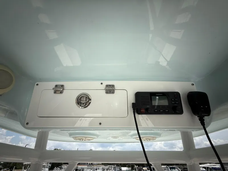 Slide: The Image of 2020 Sportsman Masters 247 Bay Boat console with radio and storage compartment. - 27