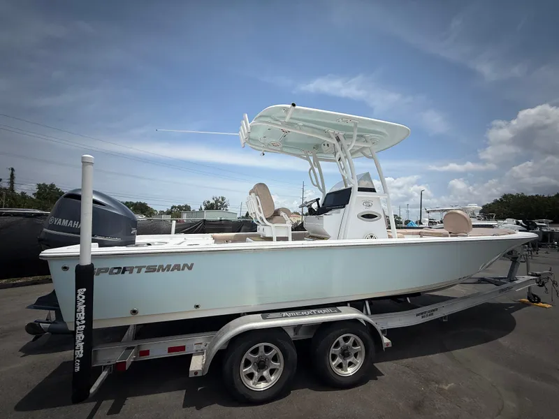 Slide: The Image of 2020 Sportsman Masters 247 Bay Boat on trailer under clear sky. - 3