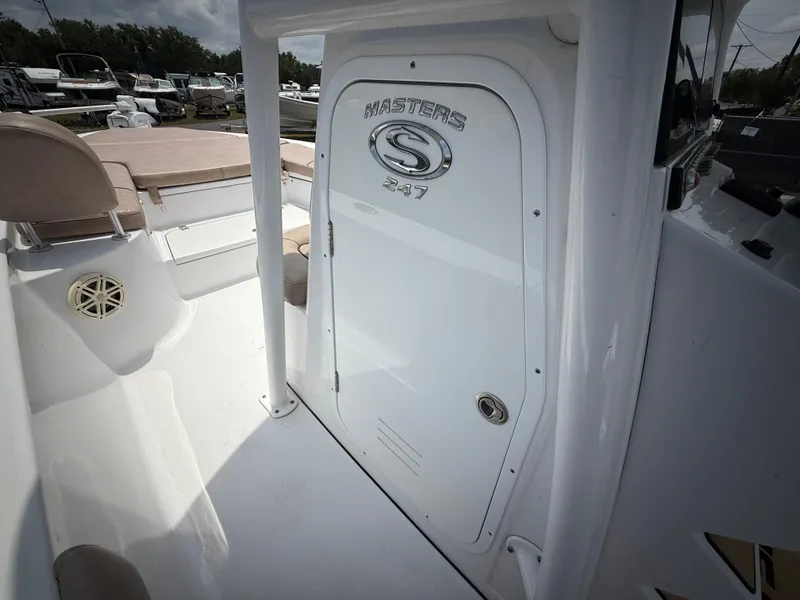 Slide: The Image of 2020 Sportsman Masters 247 Bay Boat interior, featuring sleek white design and seating area. - 30