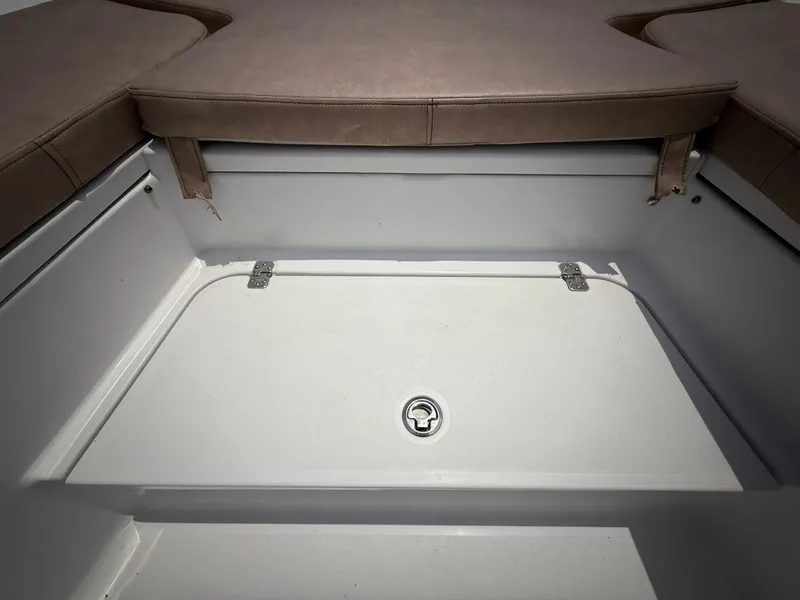Slide: The Image of 2020 Sportsman Masters 247 Bay Boat storage compartment with cushioned seating. - 32