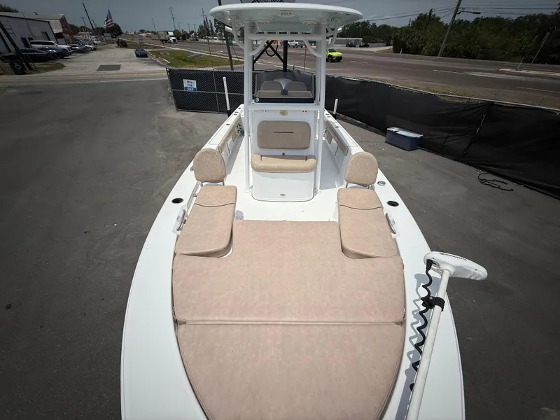 Slide: The Image of 2020 Sportsman Masters 247 Bay Boat with spacious deck and seating, parked on pavement. - 37