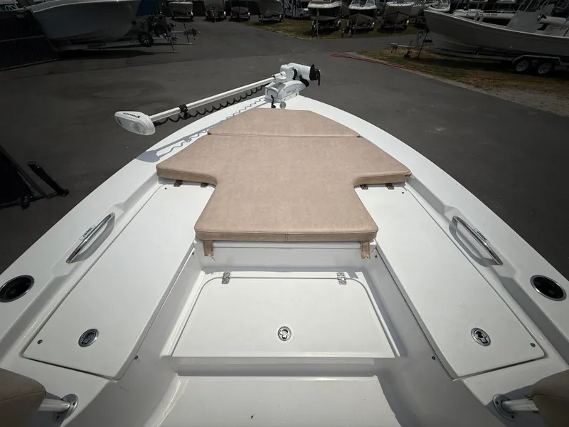 Slide: The Image of 2020 Sportsman Masters 247 Bay Boat deck with cushioned seating and storage compartments. - 39